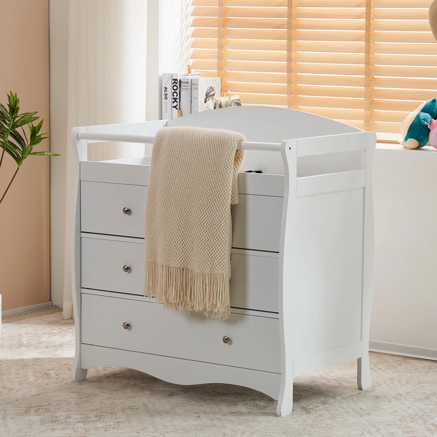 White three-drawer baby crib with safety rail, wooden baby crib with storage combination