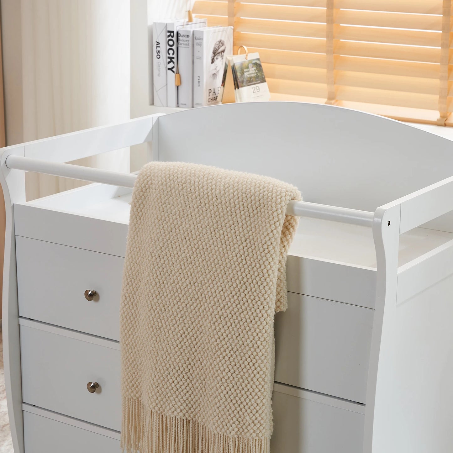 White three-drawer baby crib with safety rail, wooden baby crib with storage combination